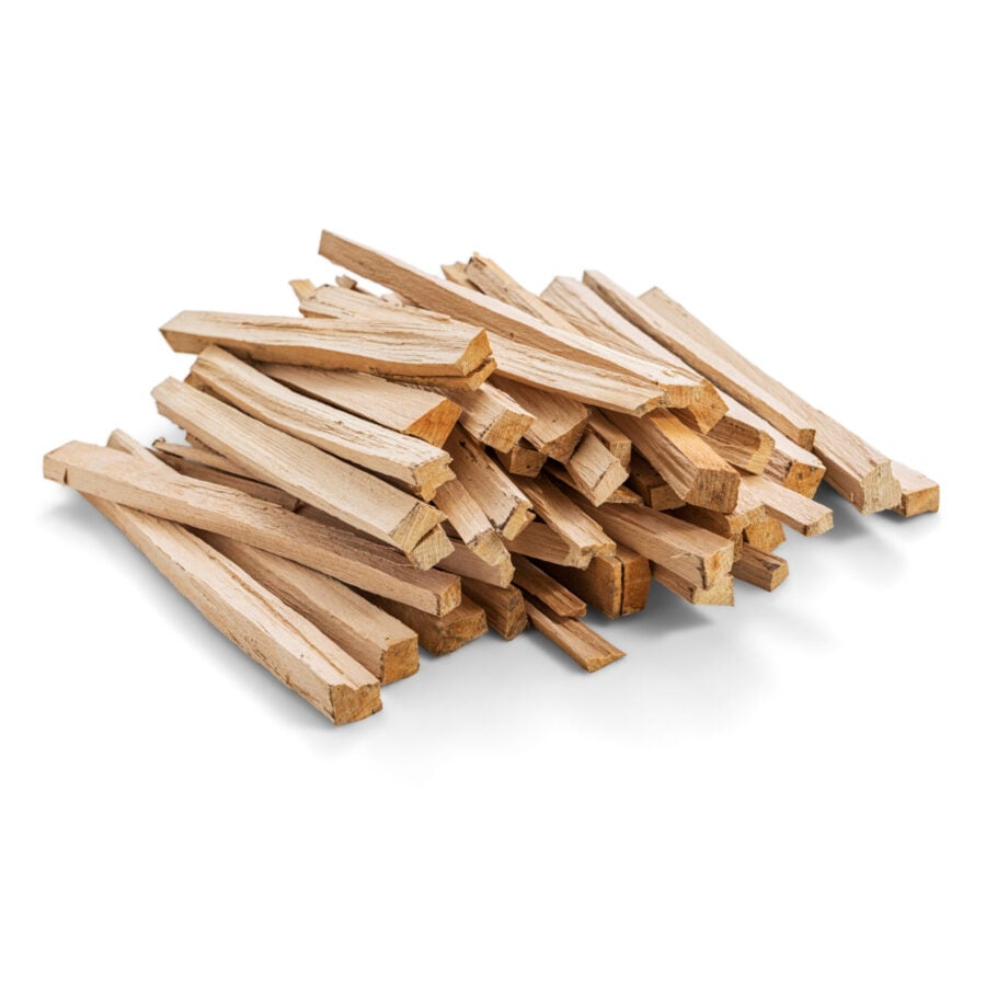 Loose pile of kiln-dried kindling on a white background